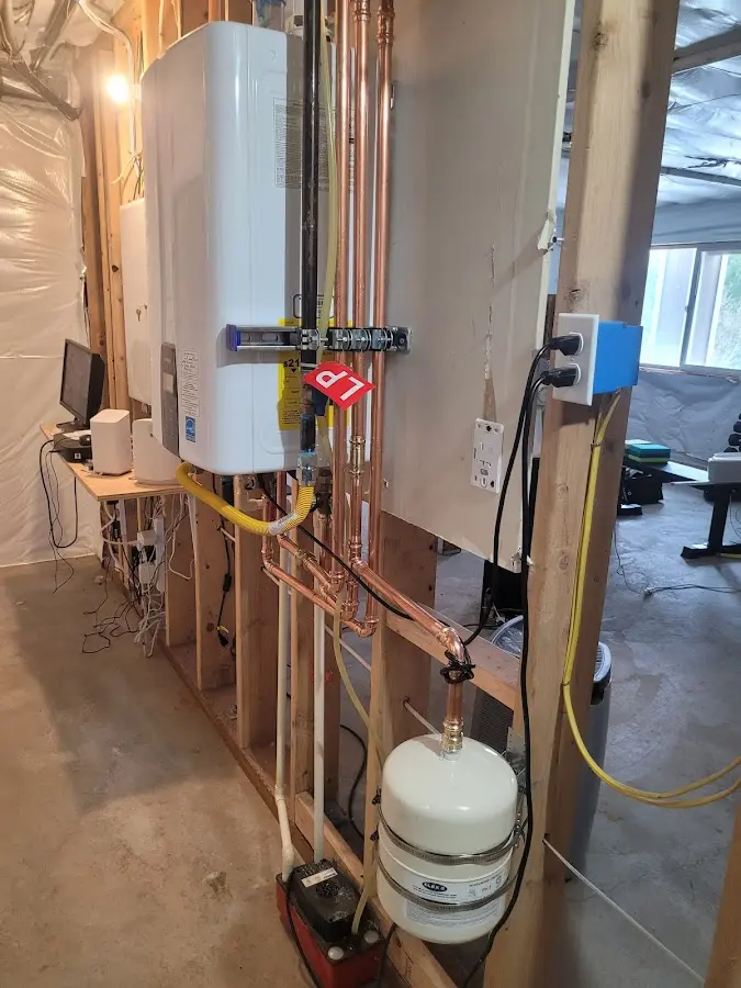 Licensed plumber repairing a kitchen sink in Orchards